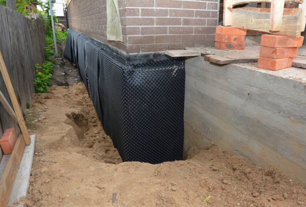 Happy homeowners after waterproofing job in Bensalem